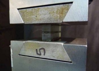 Testing of Adhesion on Laminated Glass Using Photometric Measurements