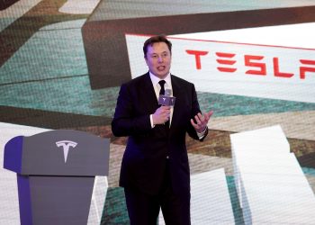 Tesla shares hit record closing price