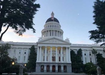 California uses funding as threat over virus measures