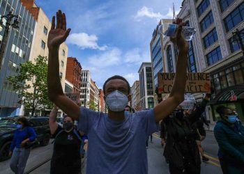 White cops in black communities underscore tension in Michigan protests