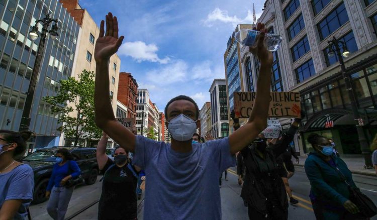 White cops in black communities underscore tension in Michigan protests