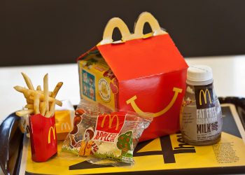 McDonald’s is passing along more fees to franchisees, reigniting tensions