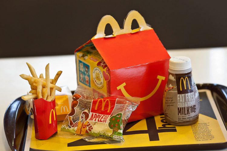 McDonald’s is passing along more fees to franchisees, reigniting tensions