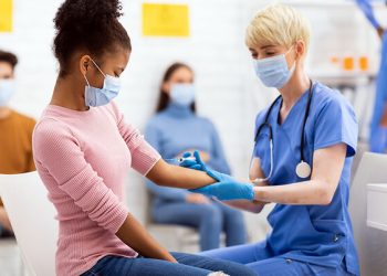 Vaccine distribution in burdened communities begins with building trust