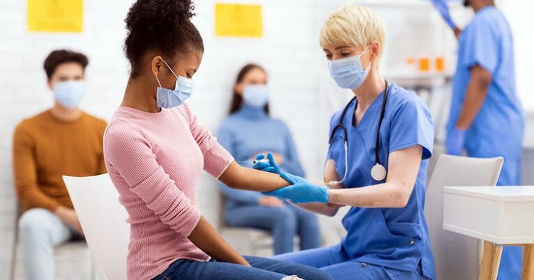 Vaccine distribution in burdened communities begins with building trust