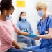 Vaccine distribution in burdened communities begins with building trust